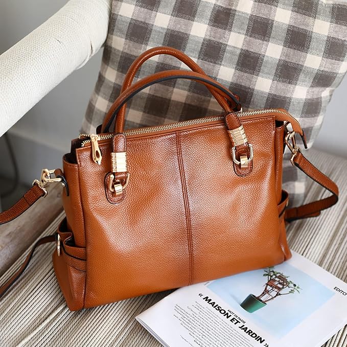 Elegant brown leather handbag on a marble surface
